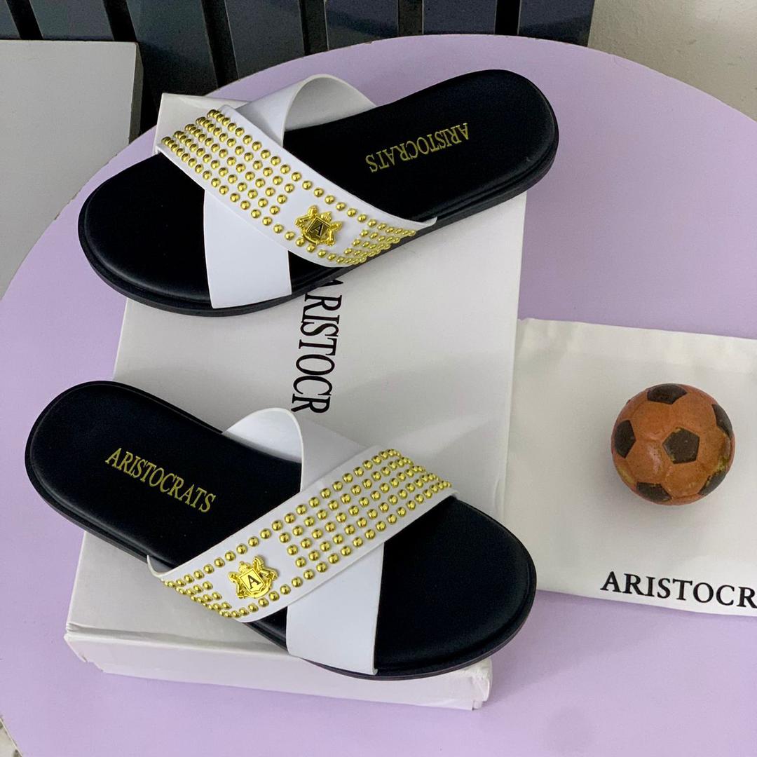 2112cb48-2100-4e57-9dac-e1bc635e6445 ARISTOCRATS White Leather & Black Sole Slippers – Sleek Contrast | Available at Arvoluxury - Image 1