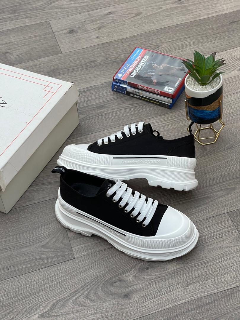 1de9b1f1-a925-44b0-a37e-26e87c2d58e8 McQueen Tread Slick Lace Up Sneakers in Black Canvas | Available at Arvoluxury - Image 1