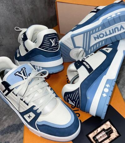 A pair of blue and white Louis Vuitton sneakers on an orange box, perfect for stylish men in Nigeria.