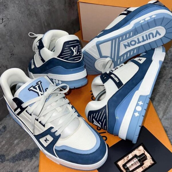 A pair of blue and white Louis Vuitton sneakers on an orange box, perfect for stylish men in Nigeria.