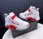 A pair of white and red Air Jordan high-top sneakers on display, perfect for sneaker enthusiasts in Nigeria.