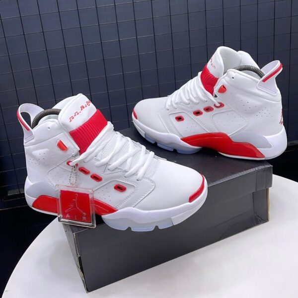 A pair of white and red Air Jordan high-top sneakers on display, perfect for sneaker enthusiasts in Nigeria.