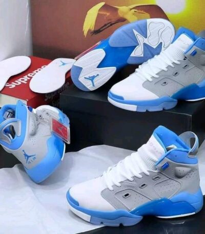 A pair of white and red Air Jordan high-top sneakers on display, perfect for sneaker enthusiasts in Nigeria.