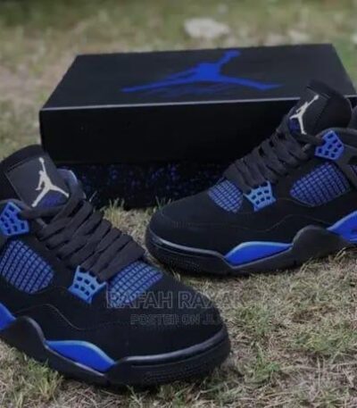 A pair of black and blue Air Jordan sneakers with box, perfect for men, stylish and comfortable.
