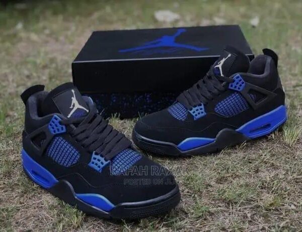 A pair of black and blue Air Jordan sneakers with box, perfect for men, stylish and comfortable.