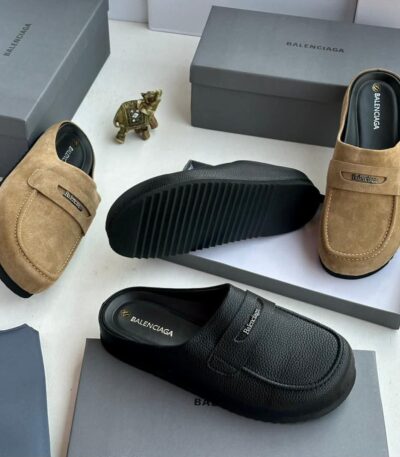 A stylish display of tan and black suede moccasin loafers, showcasing the luxurious design and premium materials of ArvoLuxury's footwear collection.