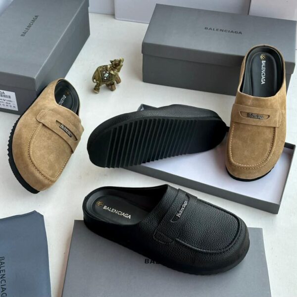 A stylish display of tan and black suede moccasin loafers, showcasing the luxurious design and premium materials of ArvoLuxury's footwear collection.