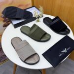 A pair of olive green ribbed double strap slide sandals on a white surface, showcasing the comfort and style of ArvoLuxury's premium footwear.
