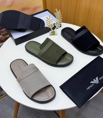 A pair of olive green ribbed double strap slide sandals on a white surface, showcasing the comfort and style of ArvoLuxury's premium footwear.