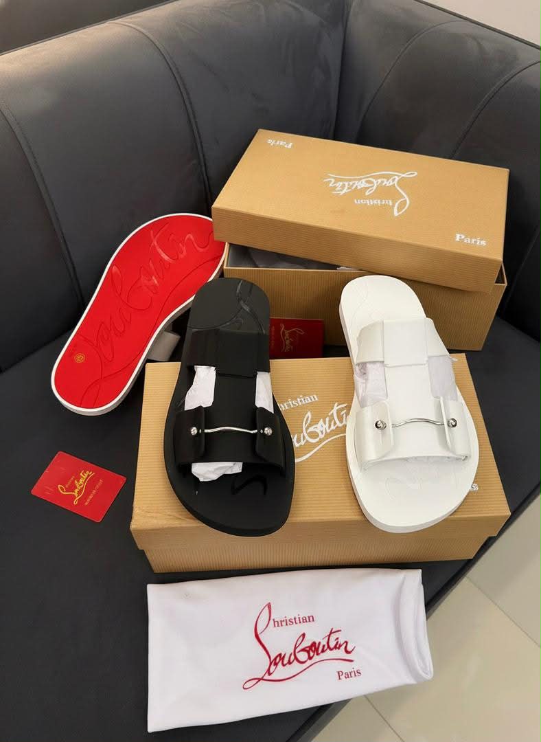 root Luxury Christian Louboutin Paris slide sandals in black and white, displayed with box and accessories.
