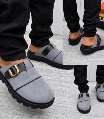 A stylish pair of grey loafers with a gold buckle and black sole, perfect for making a lasting impression.