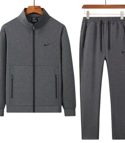A stylish grey tracksuit comprising a zip-up jacket and matching joggers, perfect for making a statement.
