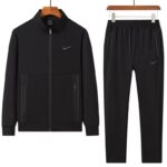 A stylish grey tracksuit comprising a zip-up jacket and matching joggers, perfect for making a statement.